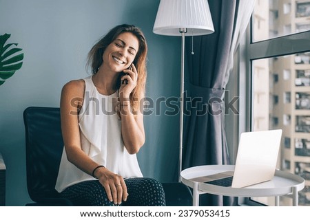 Caucasian positive woman calling via cellphone application for talking with best friend