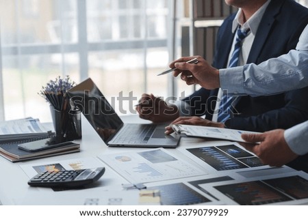 Asian male financial officer or accountant checking investment results Financial budget analysis Planning to summarize results and report to the meeting Audit concept and investment results.