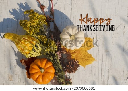 Happy Thanksgiving flat lay greeting on wood texture rustic simple background for fall season holiday.