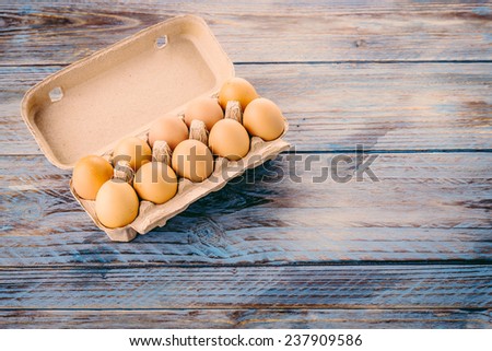 Eggs on wooden background - vintage effect style pictures