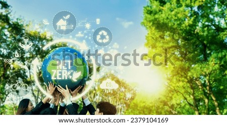 Group of business people promote environment awareness, holding big Earth ball with net zero icon symbolize ESG business environmental protection and carbon reduction effort. Panorama Reliance