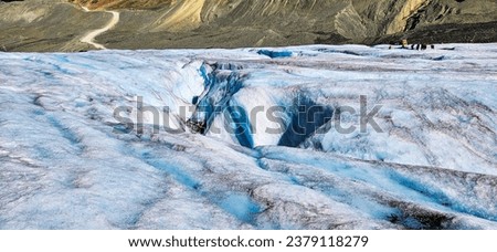 Shallow cracks appearing on Athabasca Glacier Royalty-Free Stock Photo #2379118279