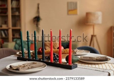 Mishumaa Saba the seven candles which represent the seven core principles of Kwanzaa on dinner table