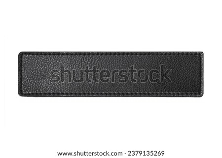 Black leather belt strap closeup isolated on white. Black stitched leather seam frame label tag isolated on white. Empty copy space fashion background. Textile frame cutout. Royalty-Free Stock Photo #2379135269