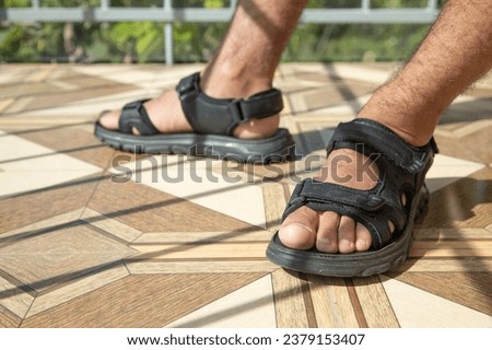 Man wearing sandals. Summer. Fashion Royalty-Free Stock Photo #2379153407