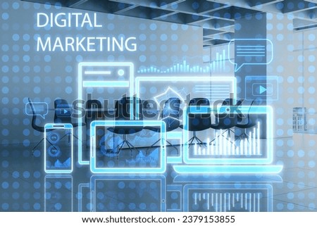 Modern office interior with creative blue gadgets and business chart hologram on blurry pixel background. Digital marketing, finance, social network and online service concept. Double exposure
