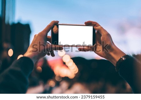 millennial woman taking photos via mobile phone with mock up for advertising website