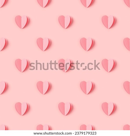Pink hearts on pink colored background, minimal trend seamless pattern, pastel monochrome color print as valentines day or wedding background. Paper cut hearts, romantic holiday concept, top view Royalty-Free Stock Photo #2379179323