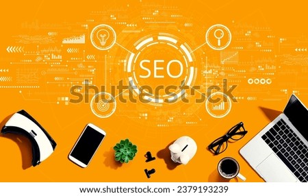 SEO concept with electronic gadgets and office supplies - flat lay