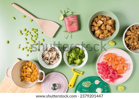 Top view of Healthy food concept.Ingredient sliced fish, mushroom, tofu, chicken fried and broccoli on a green pastel background.