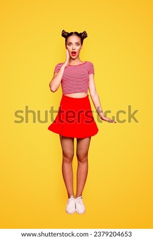 Great sale Total discount Full-length body vertical portrait of cute and joyful girl with open red mouth, shocked by great news isolated on red vivid background