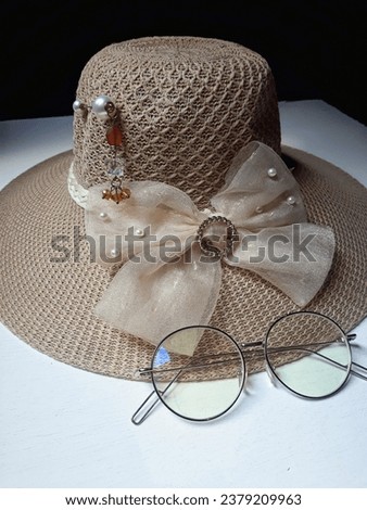 hat with hatband and glasses for vacation equipment during holiday Royalty-Free Stock Photo #2379209963