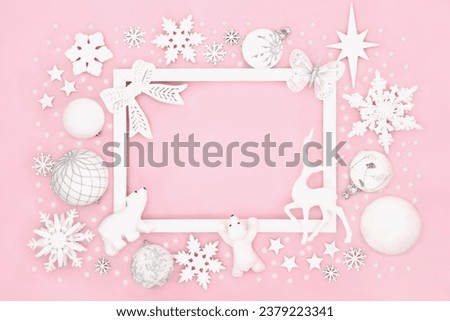 Christmas north pole decorative bauble background of sparkling decorations with white frame and snowflakes. Festive design for greeting card, label, gift tag, winter on pink.