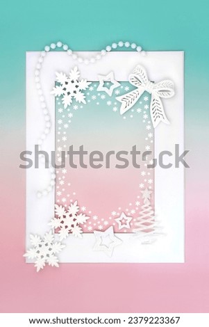 Christmas tree and bauble ornaments on white frame on green pink background with snowflakes. Festive abstract fantasy north pole border design for the holiday season.