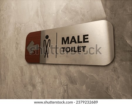 Modern male toilet sign direction at building.