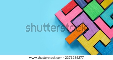 Puzzle made of multi-colored pieces as a symbol of team integration, assistance and inclusiveness. Royalty-Free Stock Photo #2379236277