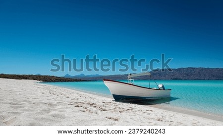 Motor boat at the paradise beach with white sand, turquoise sea and blue sky, Playa Isla Coronado, Mexico Royalty-Free Stock Photo #2379240243