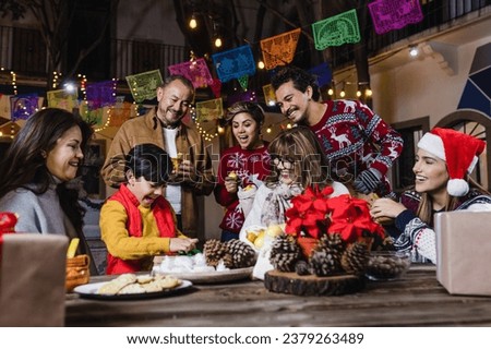 Mexican Posada, Hispanic family Singing carols in Christmas celebration in Mexico Latin America