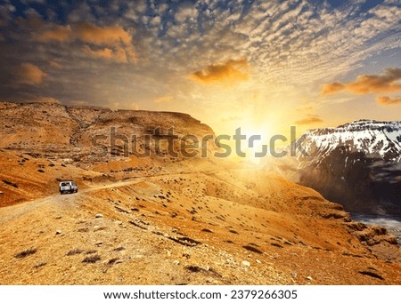 Road in mountains (Himalayas) with car. Spiti Valley, Himachal Pradesh, India Royalty-Free Stock Photo #2379266305