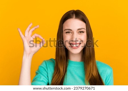 Portrait of lovely cheery girl showing ok-sign ad solution good choice isolated on vivid vibrant color background.