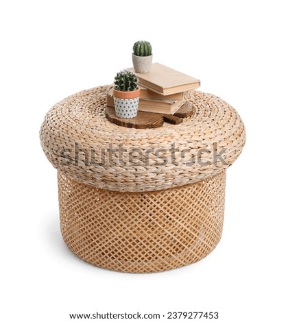 Wicker pouf with cacti and books isolated on white background Royalty-Free Stock Photo #2379277453