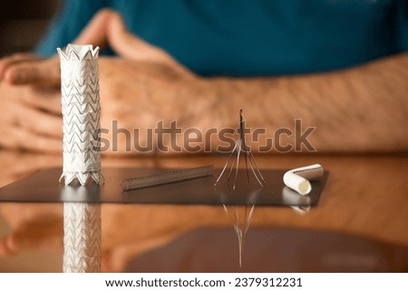 Different types of stents and vascular surgery gadgets being displayed. Royalty-Free Stock Photo #2379312231