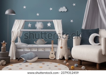 Warm and cozy child room interior with cozy bed, plush lama, white armchair, round rug, blue wall, gray box, guitar, pillows, colorful garland and personal accessories. Home decor. Template.