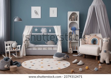 Warm composition of kid room interior with mock up poster frame, cozy bed, white armchair, stylish rug, rack, blue wall, colorful garland, lama and personal accessories. Home decor. Template. 