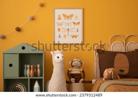 Stylish composition of child room interior with mock up poster frame, childbed, decoration, wooden block toys, plush monkey, colorful garland and personal accessories. Home decor. Template.