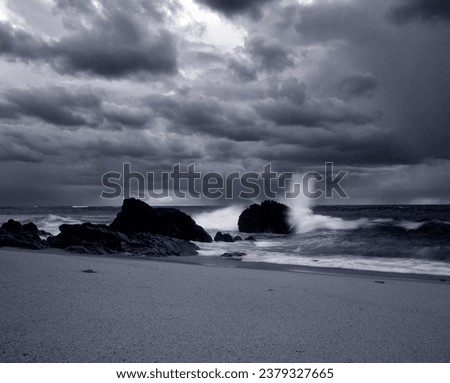 Black and white stormy sea beach. Toned blue. ANALOG medium format, film 120. Northern portuguese coast before rain.