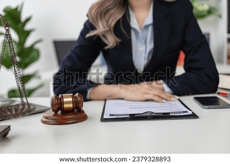 A law firm where justice stands and weighs and judges' perches stand beside justice advice and ideas. Close-up pictures
