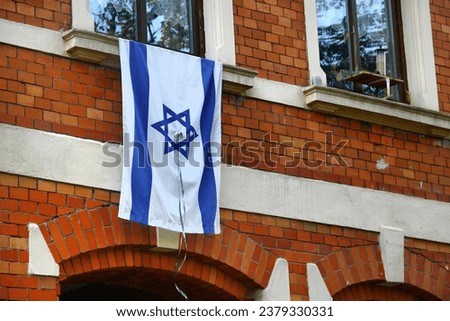 Flag of Israel hangs on a window in Reichenbach, Germany