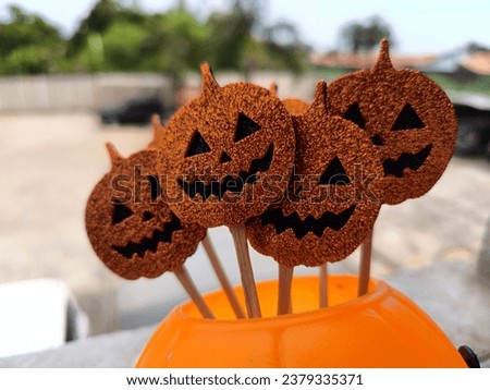 Halloween pumpkin heads over spider web. Orange picture. Orange and black. Scary and funny. Trick or treat.
