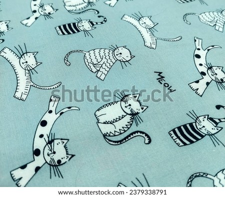 Bed sheets with cartoon cat motifs.