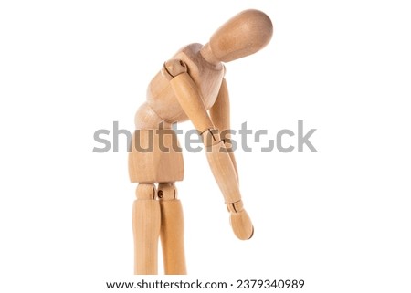A wooden mannequin standing on a white surface. This versatile image can be used for various design projects.
