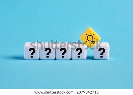 Problem solving. To find a creative business solution. Brainstorming and idea formation. Question mark and light bulb symbols on cubes. Royalty-Free Stock Photo #2379342715