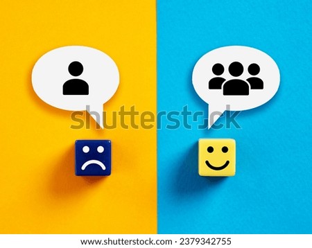 Teamwork versus individual work. Individuality or team cooperation in business. Cubes with happy and unhappy faces with team and individual symbols in speech bubbles. Royalty-Free Stock Photo #2379342755