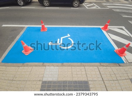 Reserved parking for vehicles of people with disabilities. Just painted floor signal