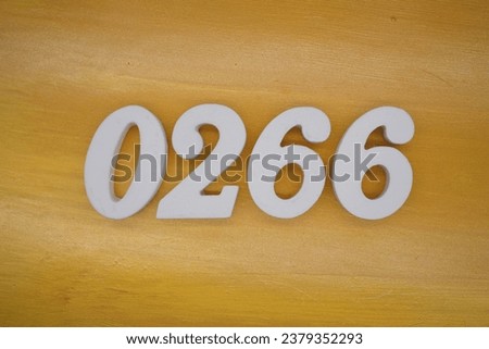 The golden yellow painted wood panel for the background, number 0266, is made from white painted wood.