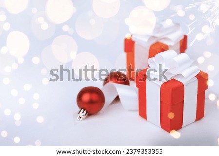Christmas red gifts with decorations on white background, copy space