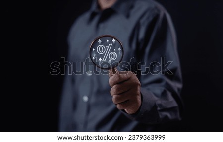 Businessman holding percentage sign in hand showing discount interest rate for commercial investment. To calculate business tax rates on a gray background.