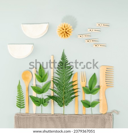 Sustainable lifestyle concept. The summer landscape is made of various eco friendly personal care and kitchen products on blue background, creative idea minimal concept