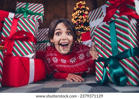 Closeup photo of young lady childish playing new year atmosphere traditions studio picture between stack gift boxes surprised reaction
