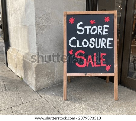 Close up shot of store closure sale sign outside retail business