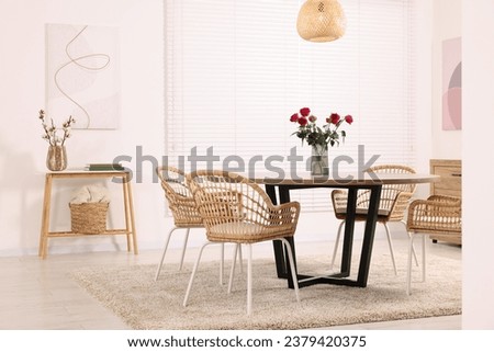 Stylish dining room interior with comfortable furniture