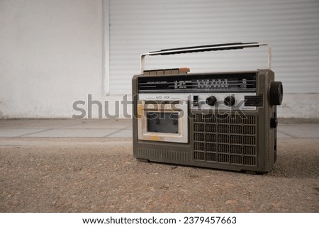 Worn Vintage 3-Band Radio Cassette Player with Recorder Royalty-Free Stock Photo #2379457663