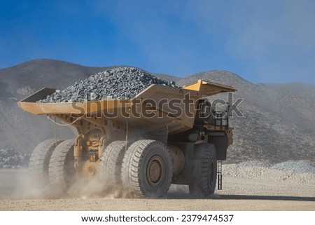 Mining trucks are among the largest vehicles on Earth. They come in various sizes, but some of the largest models can have payloads of over 400 tons. Royalty-Free Stock Photo #2379474537