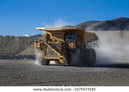 Mining trucks are among the largest vehicles on Earth. They come in various sizes, but some of the largest models can have payloads of over 400 tons. Royalty-Free Stock Photo #2379474585