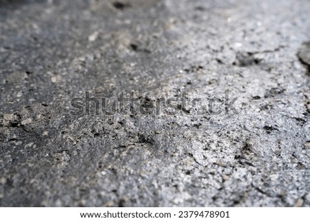 Closeup detail of shiny black volcanic rock texture