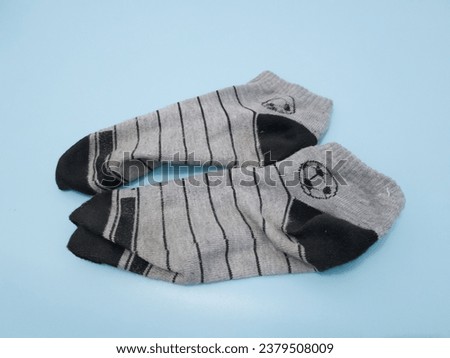 Gray socks combined with black lines on a blue background